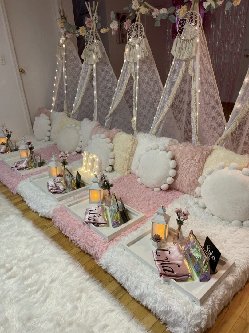 A pink and white teepee set up in a room.